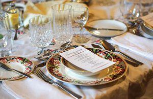 A menu on a colorful place setting.