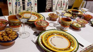 A restaurant table set with colorful dishes