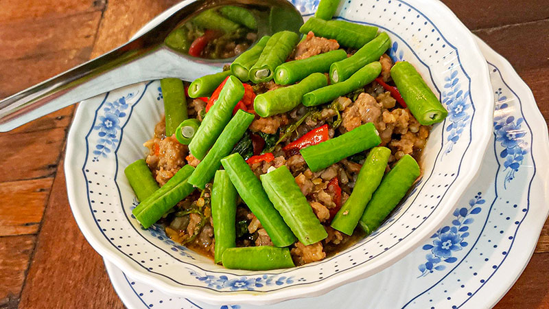 Closeup of Thai food with green beans.